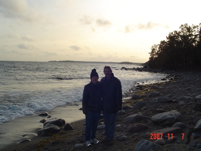 Mom and dad on the beach. Judging by the clothes it was great beach weather.
