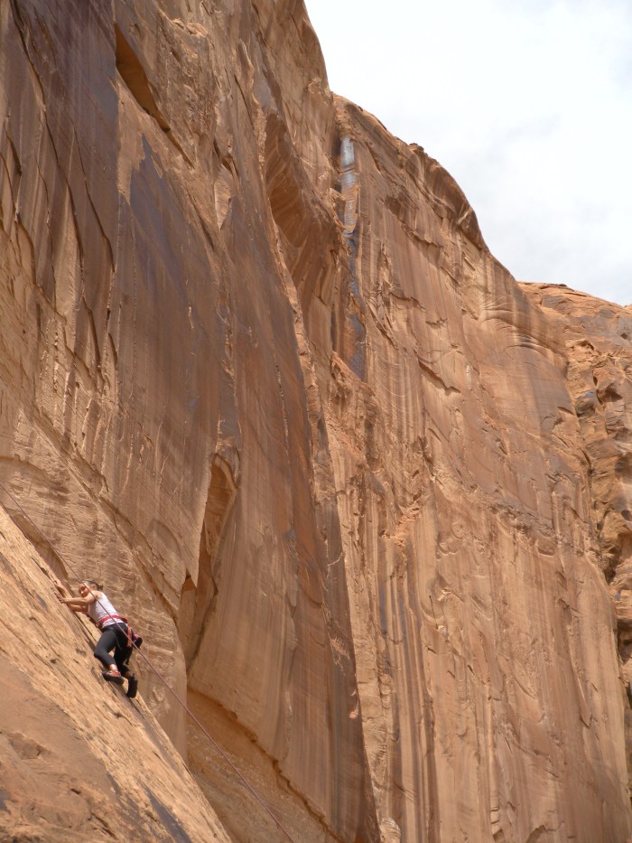 Another trip participant makes her way up the wall