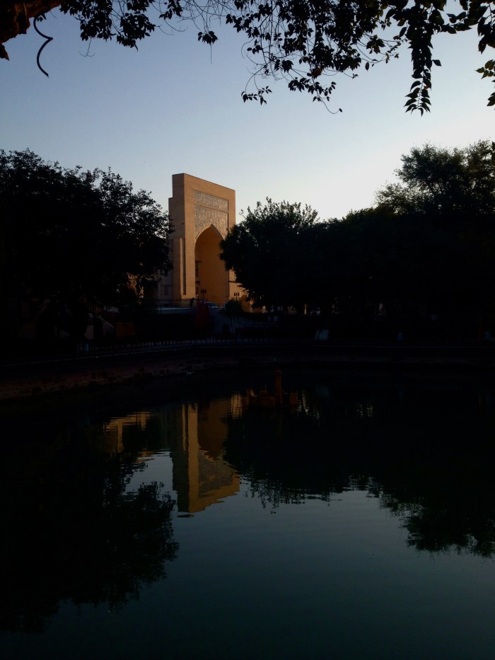 The Kukeldash Medressa in the early morning reflection of the Lyabi-Hauz