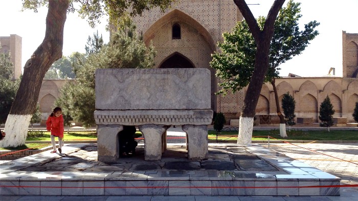 Kids crawling beneath the Koran stand, doing so will make women more fertile, according to the legends