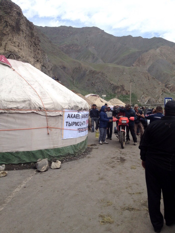 This photo is out of chronological order if you are just following the pictures up to this point. It is a political protest in Sopu Korgon, which was before the ascent of Taldyk Pass. Here my friend Paolo is pushing his motorbike through on the way to Tajikistan.
