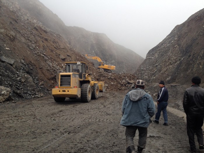 Walking over the landslide on Taldyk Pass