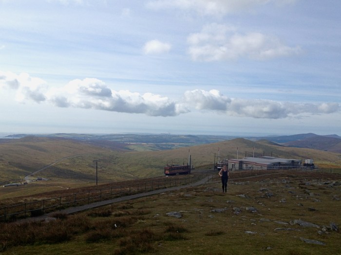 Davinia on the final stretch with the summit rail station behind.
